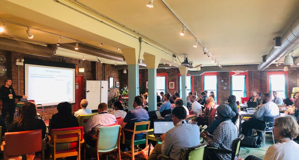 collage of pics from event showing guests at presentations and interacting