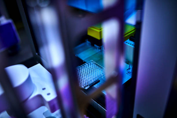 Side view of robotic arm grasping test tube rack