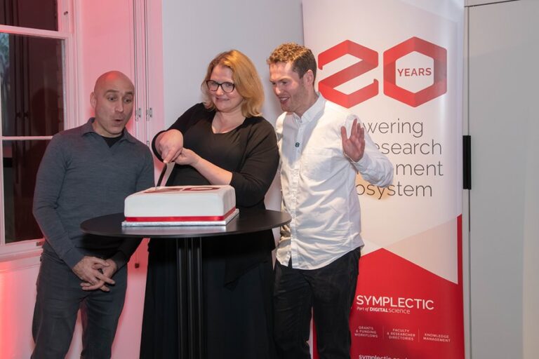 Suznne Fields cutting cake at celebration